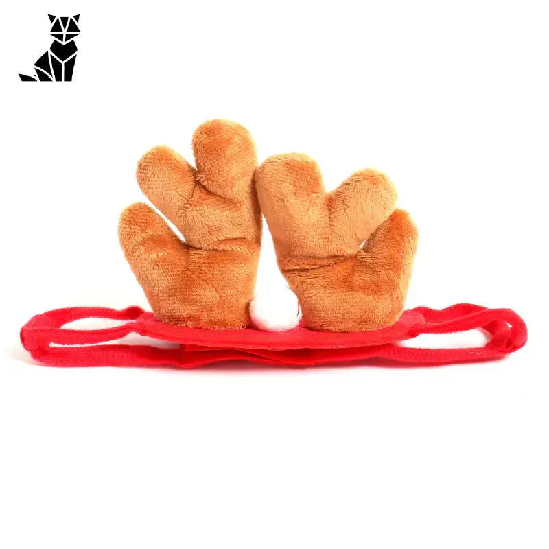 Une paire de gants avec élastique rouge pour le déguisement de chat d’Halloween, style festif