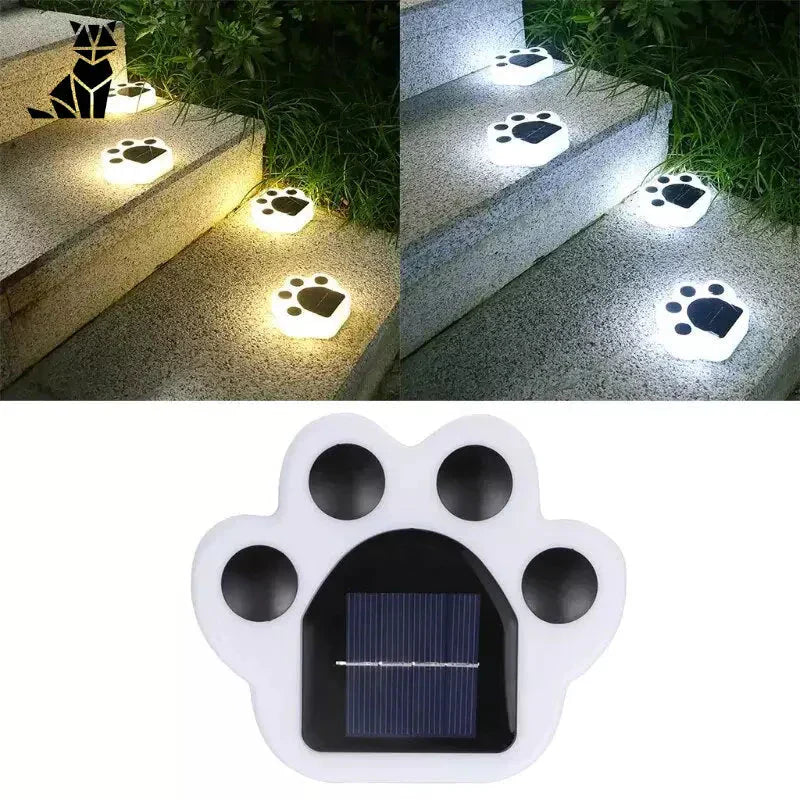 Lampe LED à énergie solaire pour pattes de chien de ’Solar Garden Lights : Cat Paws’ qui illumine l’espace